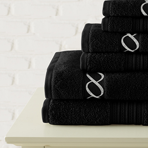 go to jewel tone embroidered rug black
